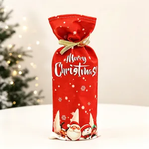 Detail of red Merry Christmas wine bottle bag with festive Santa and snowman printing