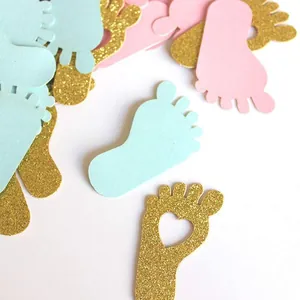 Pink and blue baby footprint paper confetti with gold glitter for gender reveal party decor