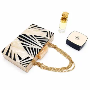 Acrylic evening clutch bag with zebra marble pattern and gold chain strap