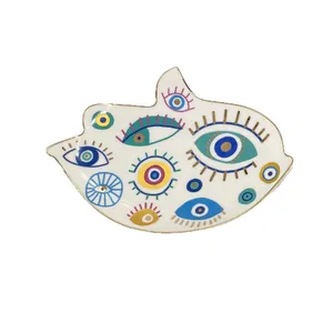 Vassoio per gioielli in ceramica malocchio con bordo dorato e motivi vivaci