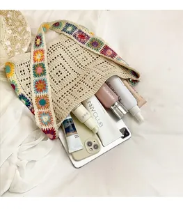 Internal view of beige crochet shoulder bag with spacious interior and floral straps