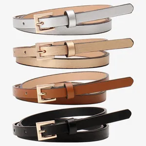 Close-up of four slim adjustable belts in silver, gold, brown, and black with square buckles