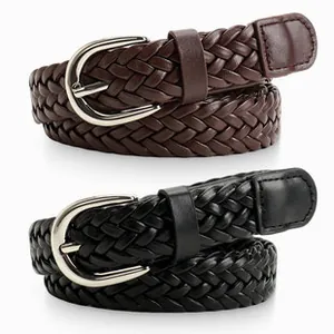 Detail of woven PU leather waist belts in black and brown with silver pin buckles