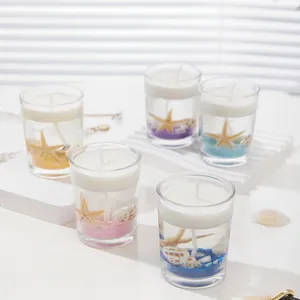 Ocean-themed jelly candles set with seashells and starfish in glass holders with five colors