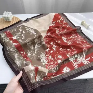 Floral print silk scarf in brick red and coffee brown patchwork with a large square design