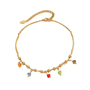 Gold stainless steel anklet featuring colorful faceted crystal charms and small beads
