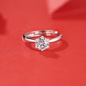 Classic 925 silver six-prong moissanite ring with adjustable band on red background