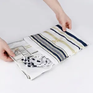 White Tallit prayer shawl with blue and gold stripes and traditional tassels