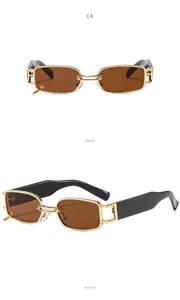 Detail of vintage steampunk sunglasses with gold metal frame and double ring chain bridge