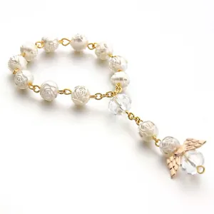 Religious style white rose pearl bracelet with gold angel wings and crystal beads