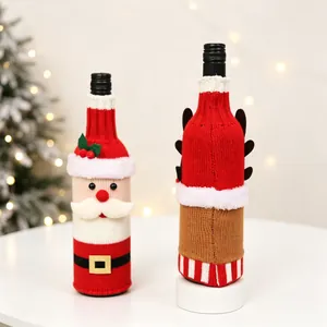 Christmas knitted wine bottle covers featuring Santa and reindeer designs for table decor
