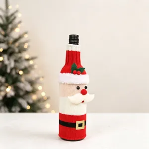 Detailed close-up of knitted Santa Claus wine bottle cover with festive embroidery