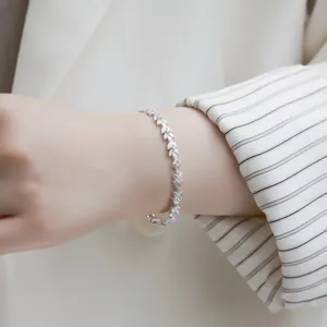 Leaf design S925 sterling silver open bracelet with micro-inlaid zircon on model wrist