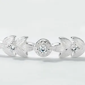Elegant leaf-shaped silver bangle with matte finish and sparkling cubic zirconia stones