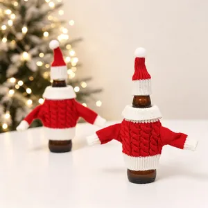 Red Christmas knit bottle sweater set with wool hat and cable pattern on festive background