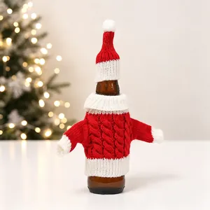 Macro detail of red and white cable-knit mini sweater and hat for wine bottle decor