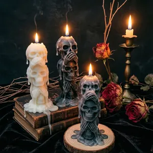 Three-tiered skull scented candles in black white and grey for Gothic Halloween decor