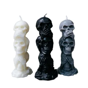 Three stacked skulls scented candles in black white and grey for Halloween gothic decor