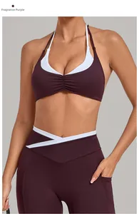 Detail von lila Halter-Sport-BH und Cross-Taille Leggings mit weißen Paspeln