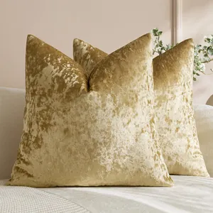 Luxurious crushed velvet gold pillow covers set on a sofa for home decor