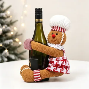 Detailed view of gingerbread chef wine bottle cover with plaid apron and chef hat décor