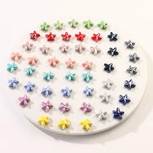 Colorful starfish glazed ceramic beads for DIY jewelry making displayed on a round plate