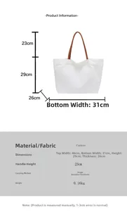 Detailed size chart for white canvas tote bag with brown leather handles showing dimensions