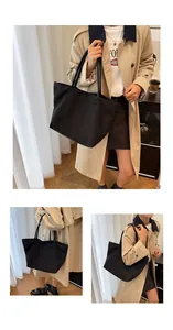Three-way view of a large black canvas tote bag for commuting and daily essentials