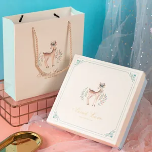 Detailed gift box set with deer illustration and matching handbag for newborns