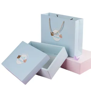 Light blue baby gift box set with matching carrier bag and cute bear illustrations
