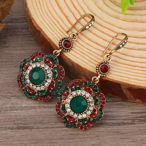 Bohemian vintage sunflower earrings with green gemstones and multicolored crystals