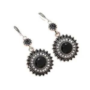 Vintage bohemian sunflower earrings with black multifaceted stone in antique silver