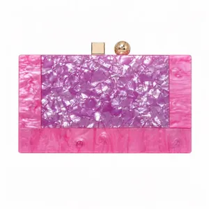 Close-up of pink and purple marble acrylic evening clutch with gold metal snap closure