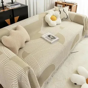 Housse de canapé gaufrée au motif géométrique ondulé avec bordures à franges
