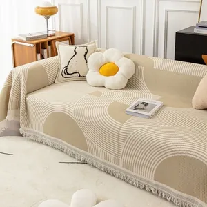 Housse de canapé gaufrée minimaliste avec motif géométrique et bordures à franges