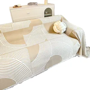 Housse de canapé gaufrée minimaliste avec motifs arches géométriques beige et franges