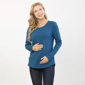 Detail shot of the hidden side zipper on this long sleeve nursing top in teal color