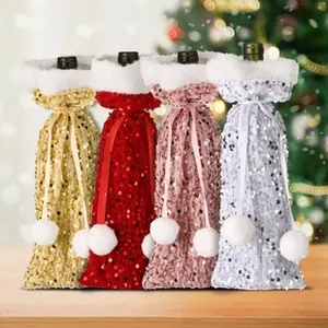 Detailed view of four sequined Christmas wine bottle bags with faux fur and pom-pom ties