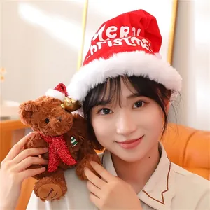 Detail of a brown plush Christmas teddy bear with a red sequin scarf and holiday hat