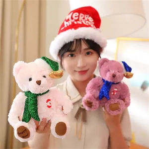 Detail of pink and purple Christmas teddy bears with Merry Christmas embroidery