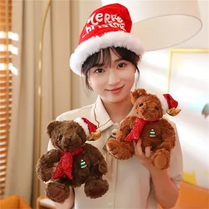 Detail of plush Christmas teddy bears with red sequin scarves and festive reindeer hats