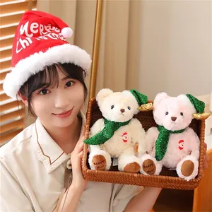 Close-up of Christmas teddy bears with green scarves and hats in a cozy gift basket