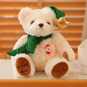 Detail of Christmas teddy bear with sequin scarf, star hat and Happy Bear embroidery