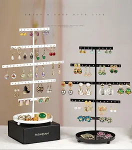 Five-tier metal jewelry organizer rack with hanging holes and a round bottom tray