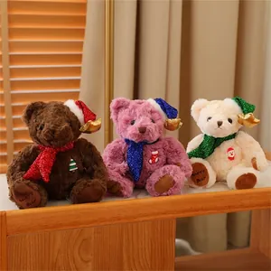 Detailed close-up of three Christmas teddy bears with sequined hats and festive pins