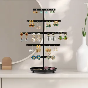 Detailed view of black 5-tier metal T-bar earring organizer with circular base tray