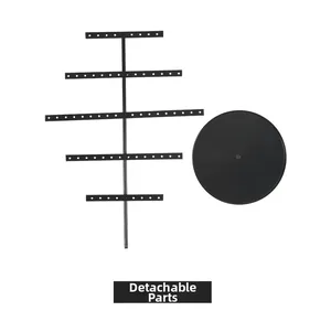 Disassembled parts of a 5-tier black metal earring organizer with a round base
