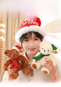 Detailed view of plush Christmas teddy bears featuring festive sequin hats and scarves
