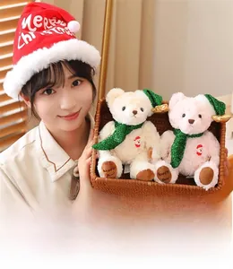 Christmas teddy bear set with festive scarves in a woven basket held by a model