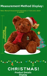 Detail view of a brown Christmas teddy bear with festive hat and holiday embroidery